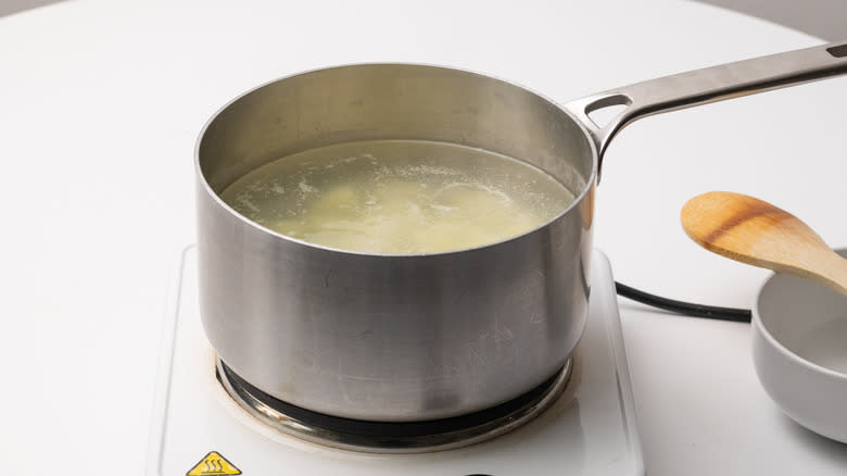 potatoes boiling in a pan