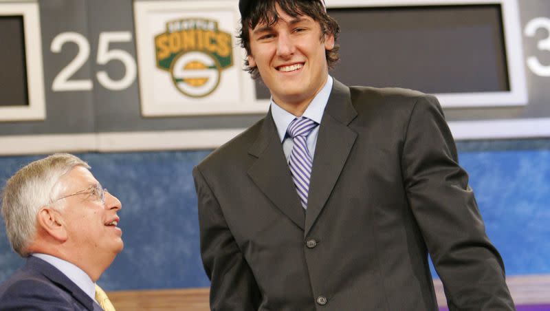 Andrew Bogut, a center from the University of Utah, is congratulated by NBA Commissioner David Stern after he is chosen by the Milwaukee Bucks as the first overall pick of the 2005 NBA draft.