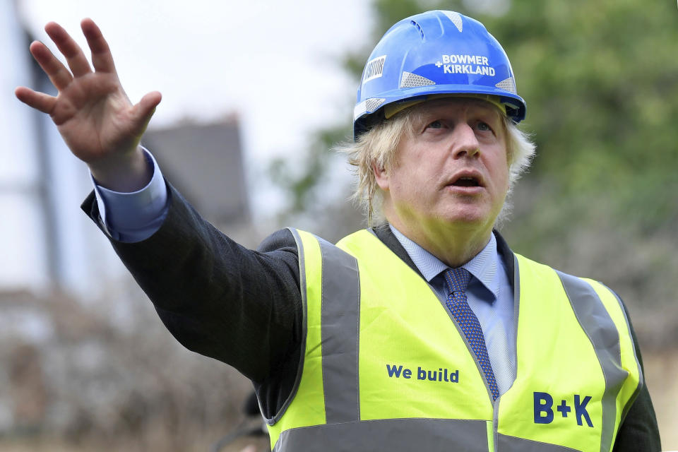 Britain's Prime Minister Boris Johnson visits the construction site of Ealing Fields High School in west London, Monday June 29, 2020. (Toby Melville/Pool via AP)