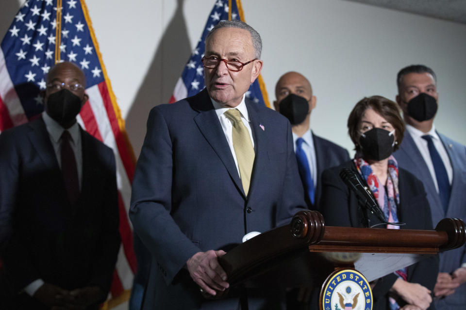 Senate Majority Leader Chuck Schumer, D-N.Y., speaks to reporters alongside, from left, Sen. Raphael Warnock, D-Ga., Sen. Cory Booker, D-N.J., Sen. Amy Klobuchar, D-Minn., and Sen. Alex Padilla, D-Calif., during a press conference regarding the Democratic party's shift to focus on voting rights at the Capitol in Washington, Tuesday, Jan. 18, 2022. / Credit: Amanda Andrade-Rhoades / AP