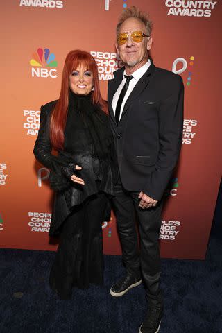 <p>Todd Williamson/NBC via Getty</p> Wynonna Judd and Cactus Moser at the People's Choice Country Awards in Nashville on Sept. 28, 2023