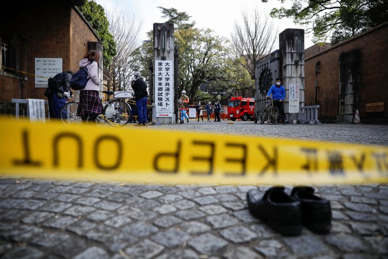 Police officers inspect at the site where a stabbing incident happened at an entrance gate of Tokyo University in Tokyo