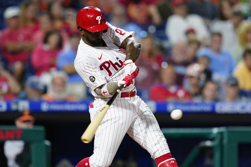 Philadelphia Phillies' Andrew McCutchen hits an RBI-double off Baltimore Orioles pitcher Dillon Tate during the sixth inning of an interleague baseball game, Tuesday, Sept. 21, 2021, in Philadelphia. (AP Photo/Matt Slocum)