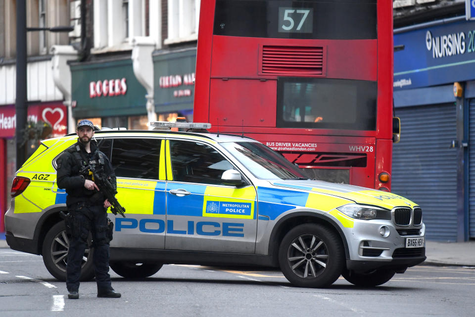 Armed police at the scene in Streatham High Road, south London after a man was shot dead by armed officers, with police declaring the incident as terrorist-related.