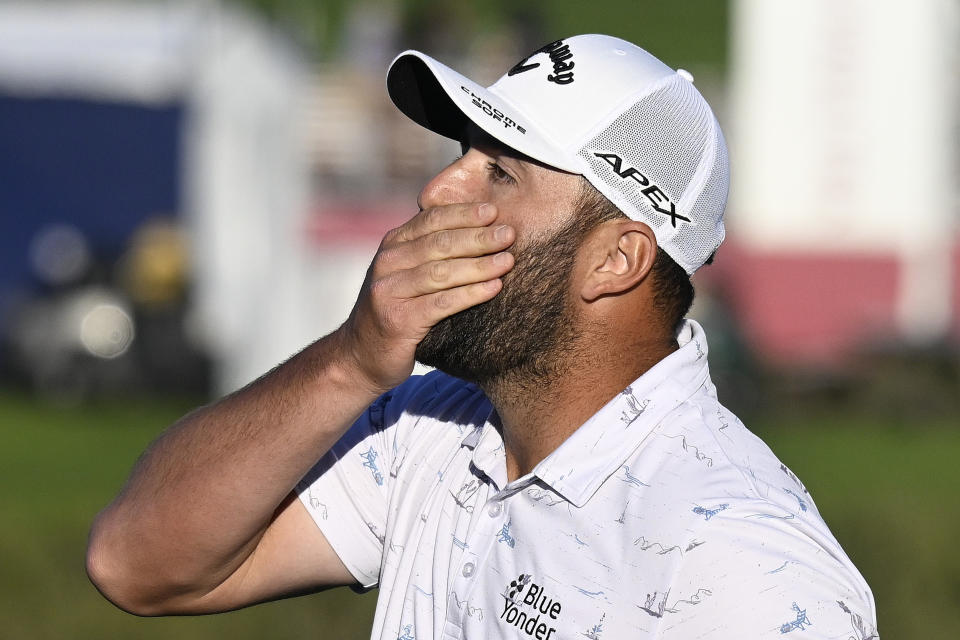 John Rahm of Spain reacts after missing a putt on the 16th hole of the South Course during the third round of the Farmers Insurance Open golf tournament, Friday Jan. 28, 2022, in San Diego. (AP Photo/Denis Poroy)