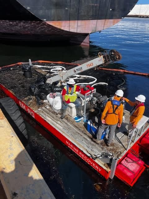 File art of U.S. Coast Guard Sector St. Petersburg crews cleaning up an oil spill at Seaport Manatee this month.