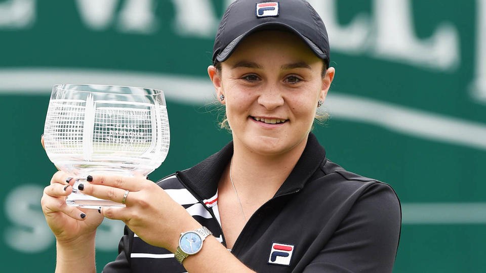 Ashleigh Barty poses with the trophy.. (Photo by PAUL ELLIS/AFP/Getty Images)