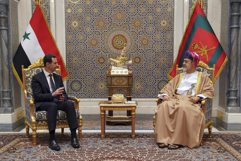 In this photo released by the official Syrian state news agency SANA, Omani Sultan Haitham bin Tariq, right, receives Syrian President Bashar Assad in the capital Muscat, Oman, Monday, Feb. 20, 2023. Assad visited the gulf nation of Oman Monday on his first official visit since the deadly Feb. 6 quake, his office said. (SANA via AP)