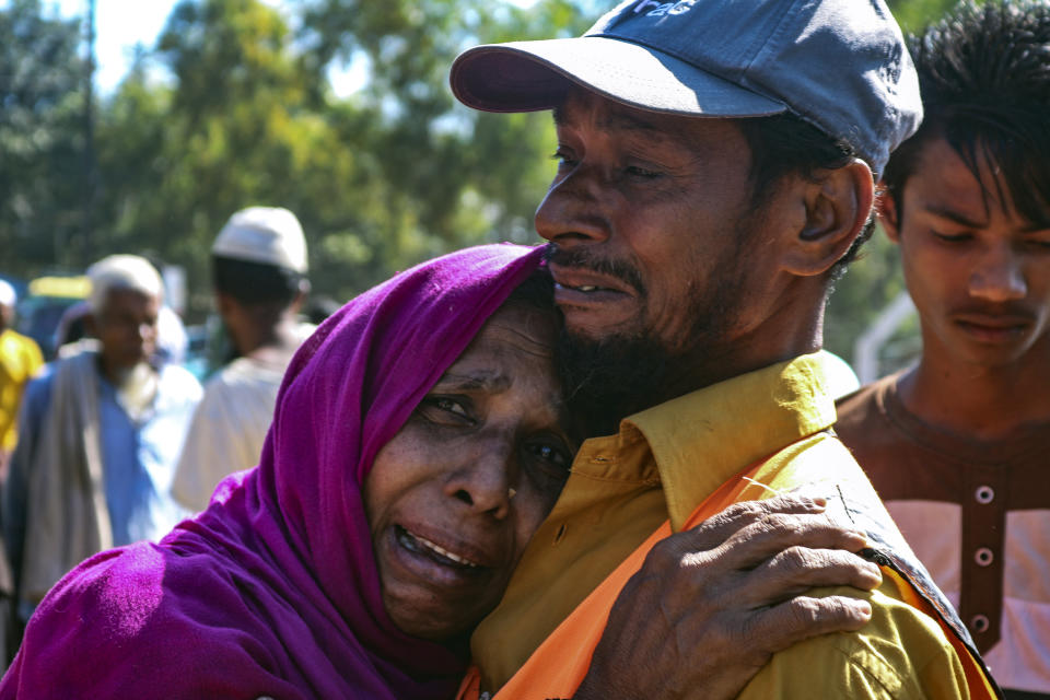 A Rohingya refugee woman who is among those being moved to an island called ‘Bhasan Char’ cries outside a transit area where they are temporally housed in Ukhiya, Bangladesh, Thursday, Dec.3, 2020. (AP Photo/ Shafiqur Rahman)