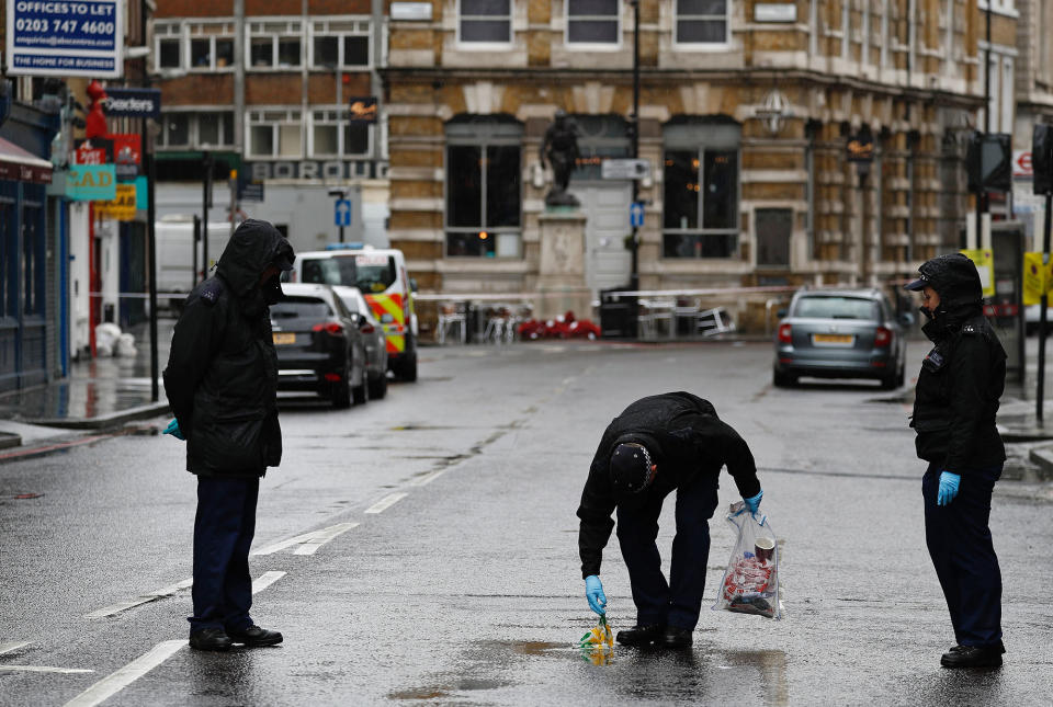 <p>A police officer carries an evidence bag as he works with colleagues on Borough High Street, close to Borough Market, in London on June 6, 2017, as the police investigations continue following the June 3 terror attack. (Photo: Odd Andersen/AFP/Getty Images) </p>