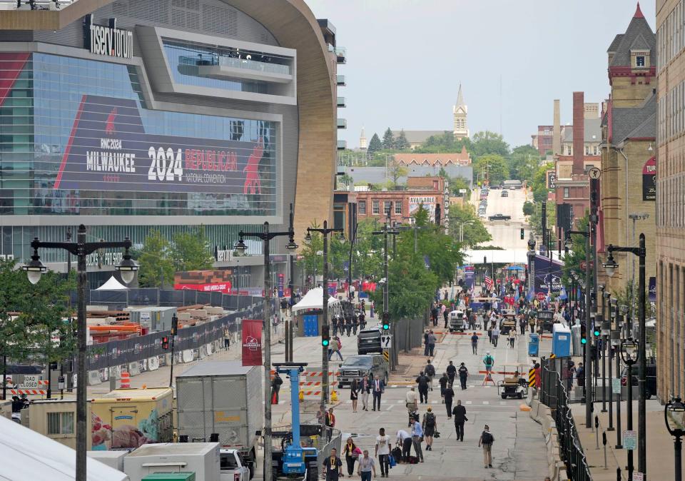 People walk within the secure perimeter near Fiserv Forum during the second day of the Republican National Convention at the Fiserv Forum. The second day of the RNC focused on crime and border policies.