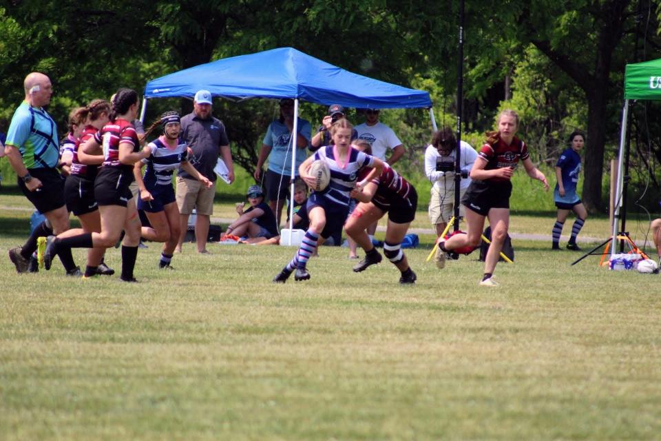 Tori Holmes of the Corning Rugby Club runs with the ball in a 22-20 win over Orchard Park in the state final June 4, 2023 at Tim Russert Park in Buffalo.