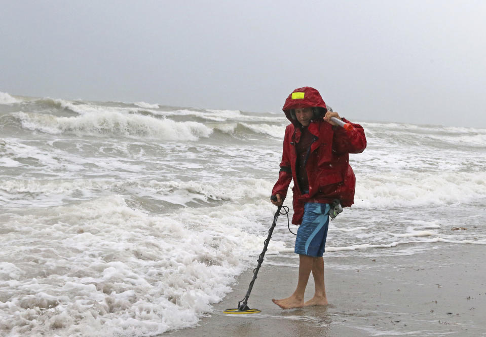 <p> Local resident Mike Squillace looks for metal at Dania Beach, Fla., as Tropical Storm Gordon passes by South Florida with wind gust and heavy rainfall Monday, Sept. 3, 2018. (David Santiago/Miami Herald via AP) </p>