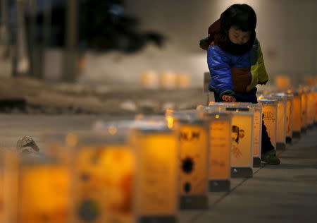 Lanterns from northern Japanese city Natori are illuminated during an event to pray for the reconstruction of areas devastated by the March 11, 2011 earthquake and tsunami, and mourn victims of the disaster at the Canadian embassy in Tokyo, Japan, March 10, 2016, a day before the five-year anniversary of the disaster. REUTERS/Issei Kato