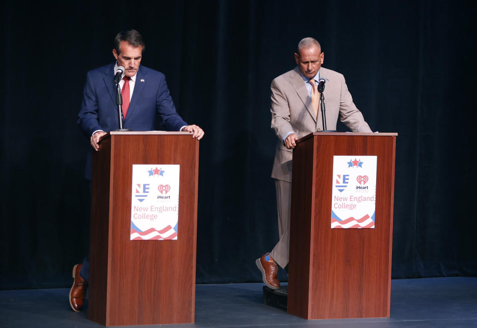 FILE - New Hampshire Republican U.S. Senate candidate Don Bolduc, right, stands next to Kevin Smith during a debate, Sept. 7, 2022, in Henniker, N.H. New Hampshire will hold its primary on Tuesday, Sept. 13. (AP Photo/Mary Schwalm, File)