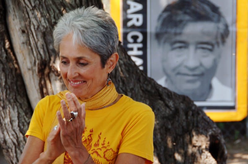 Folk singer Joan Baez smiles during a prayer service to raise awareness about the future of a 14-acre urban farm threatened with demolition in the south side of Los Angeles in 2006. File Photo by Jim Ruymen/UPI