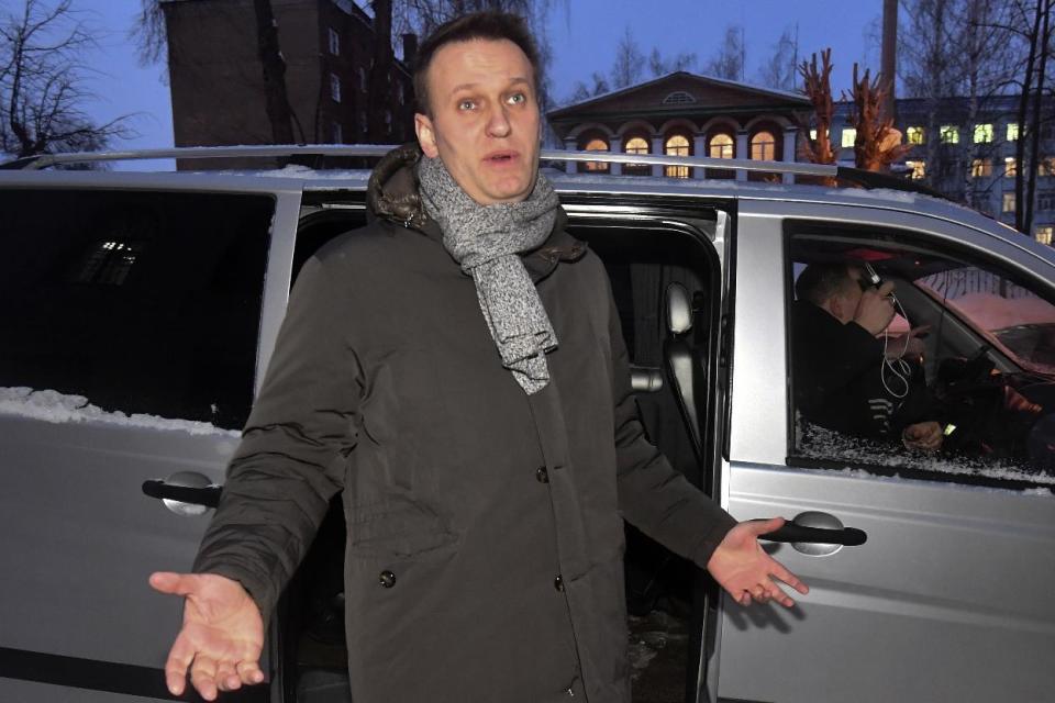 Russian opposition leader Alexei Navalny gestures while speaking to journalists as leaves the court in Kirov, Russia, Wednesday, Feb. 8, 2017. A Russian court on Wednesday found opposition leader Alexei Navalny guilty in the retrial of a 2013 fraud case, which disqualifies him as a candidate for president next year. However, an associate said Navalny will carry on with the campaign he announced in December. (AP Photo/Sergei Bonurin)