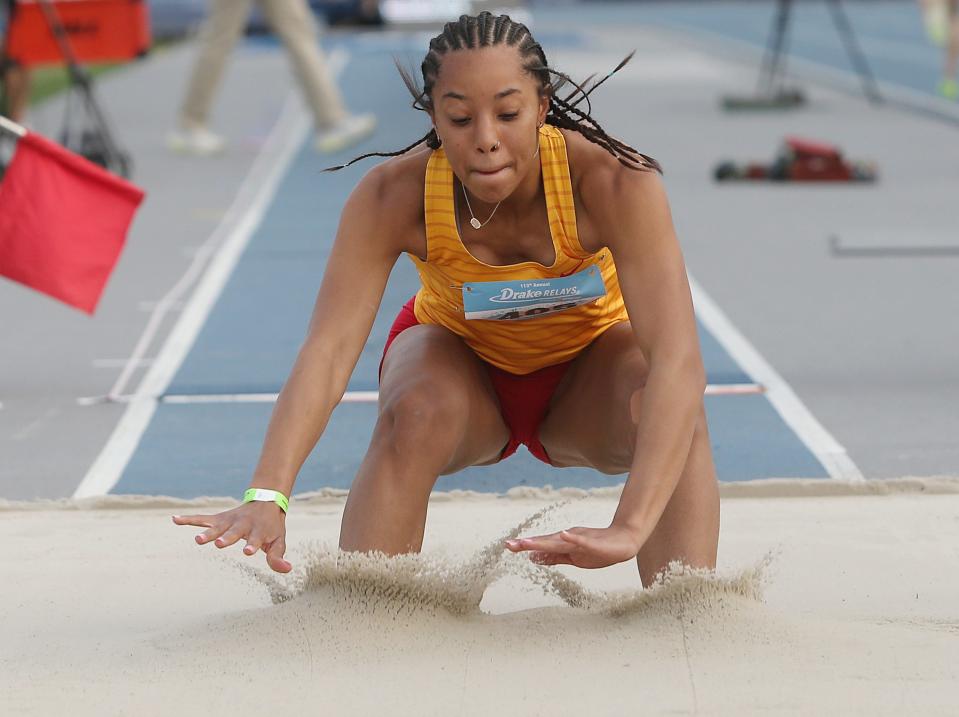 Carlisle's Isabella Noring lands during the girls' long jump in the Drake Relays at Drake Stadium on Thursday, April 27, 2023, in Des Moines, Iowa.