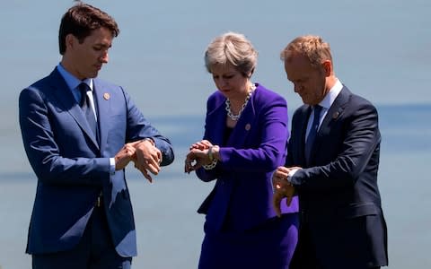 Justin Trudeau, Theresa May and Donald Tusk - Credit: IAN LANGSDON/POOL/AFP/Getty Images