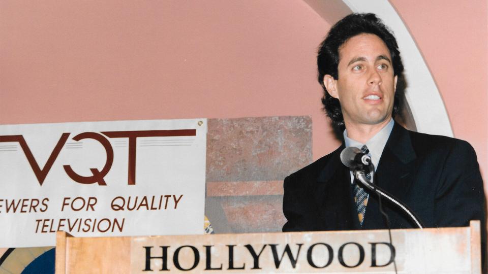 Jerry Seinfeld on a podium at a Viewers for Quality Television event.