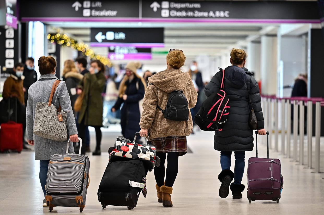 Passengers are seen at Edinburgh airport.