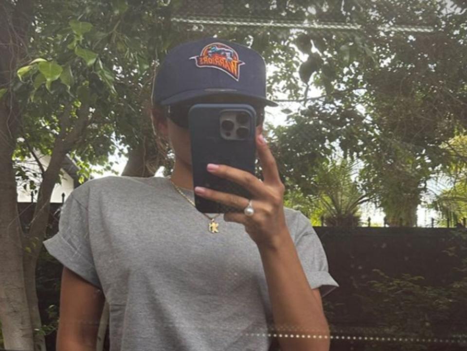 Zendaya shares selfie in a car reflection with a Golden State Warriors hat and ring on her finger (@zendaya on Instagram)