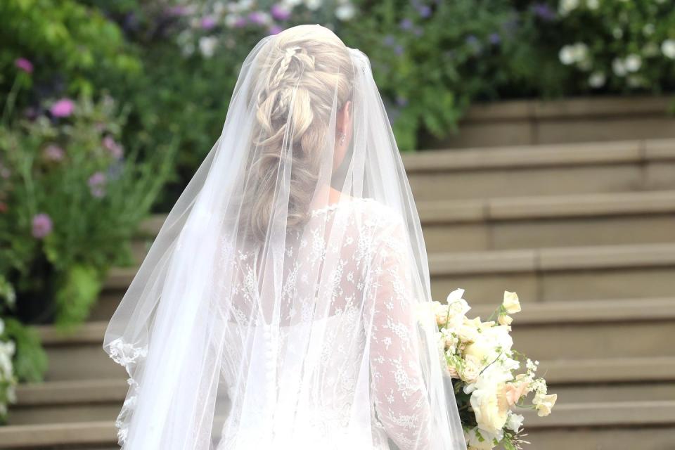 A closeup of the brides intricate hairstyle and veil