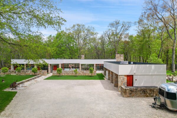 Nestled on a large, tree-filled lot, the secluded home offers an idyllic private escape, all while being conveniently located outside New York City.