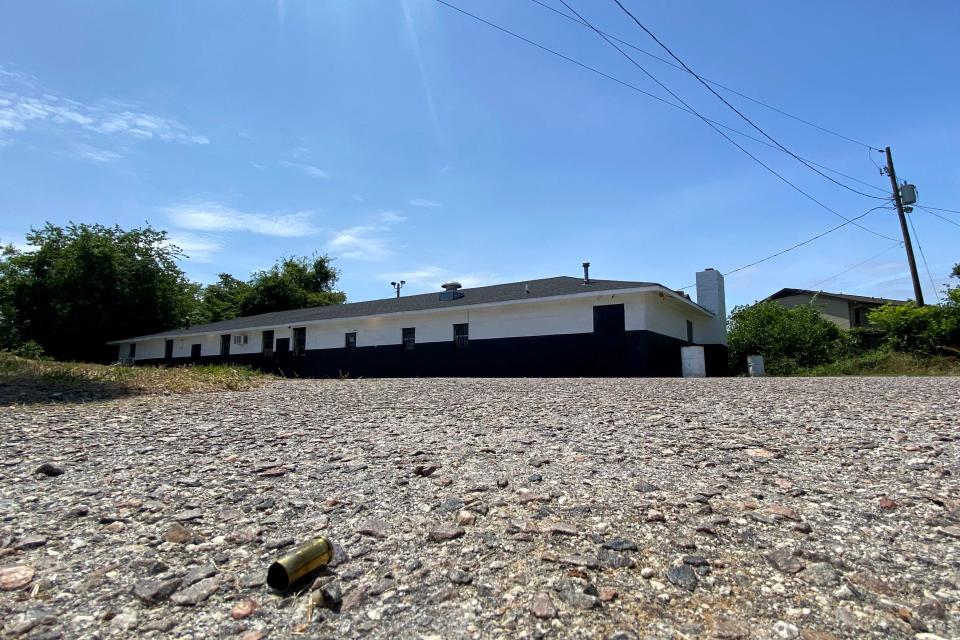 FILE - Empty shell casings sit on the ground outside the Outcast motorcycle club headquarters on East Boundary and Sand Bar Ferry Road in Augusta, Ga., on Monday, May 15, 2023. A shooting at the intersection over the weekend left two dead and four injured.