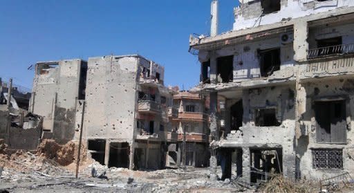 A handout picture released by the Syrian opposition's Shaam News Network shows damages in the district of Juret al-Shayah in the flashpoint city of Homs on July 3. AFP cannot independently verify this image