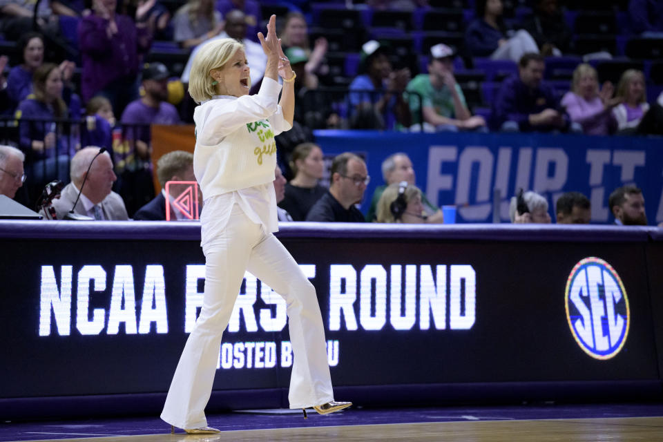 LSU head coach Kim Mulkey encourages the crowd during the second half of the team's first-round college basketball game against Hawaii in the women's NCAA Tournament in Baton Rouge, La., Friday, March 17, 2023. (AP Photo/Matthew Hinton)