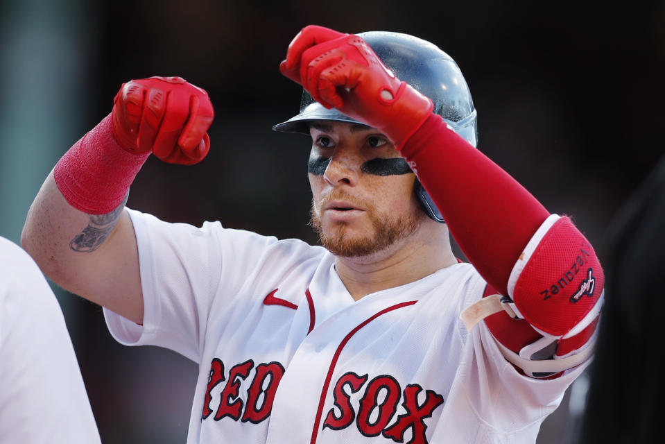 Boston Red Sox's Christian gestures after hitting an RBI single during the seventh inning of the team's baseball game against the Milwaukee Brewers, Saturday, July 30, 2022, in Boston. (AP Photo/Michael Dwyer)