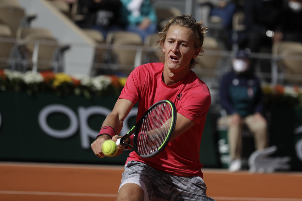 Sebastian Korda of the U.S. plays a shot against Spain's Rafael Nadal in the fourth round match of the French Open tennis tournament at the Roland Garros stadium in Paris, France, Sunday, Oct. 4, 2020. (AP Photo/Alessandra Tarantino)