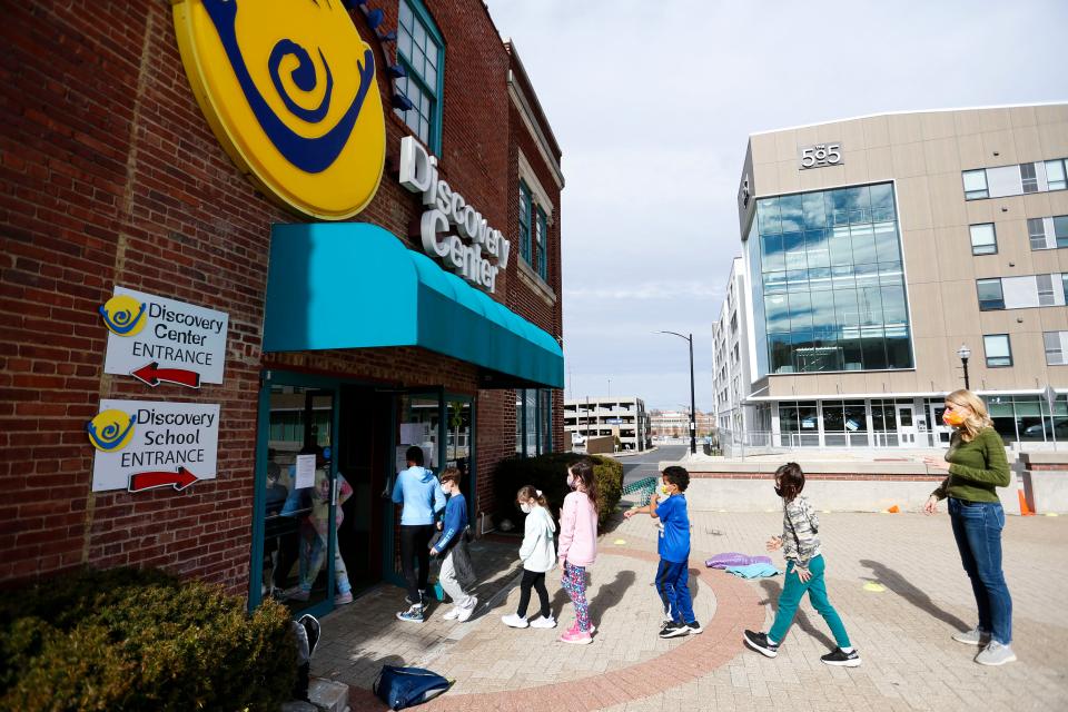 Students in the Discovery Center's Emergency Discovery School program line up to return to class on Monday, Jan. 24, 2022.