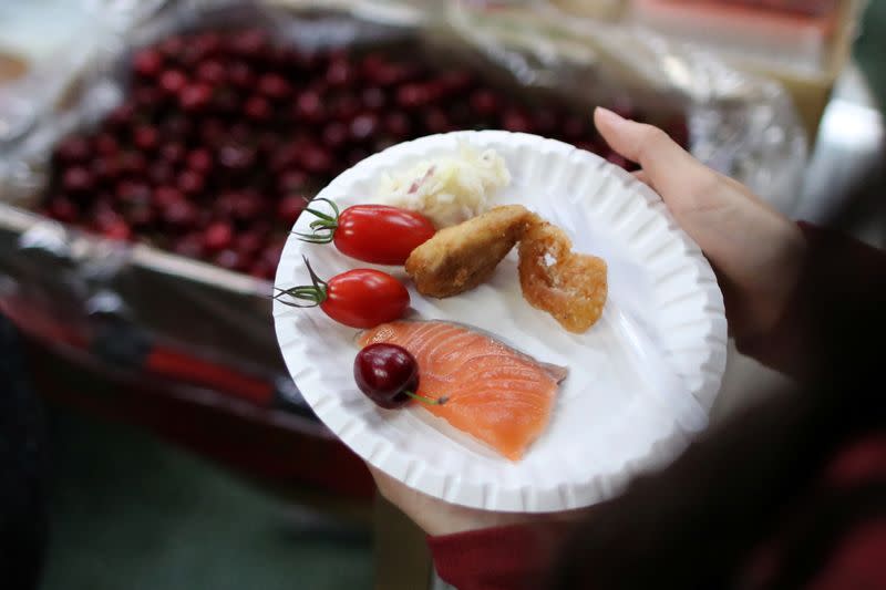 Protesters serve themselves with free Christmas dinner offered by a local restaurant in Hong Kong