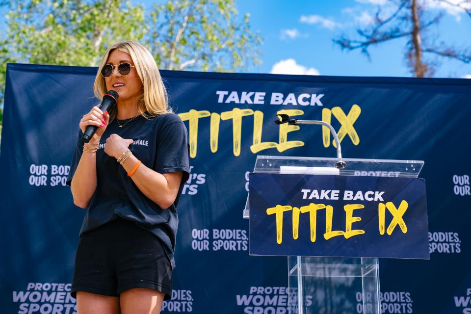 Riley Gaines speaks at an Our Bodies, Our Sports bus tour rally.