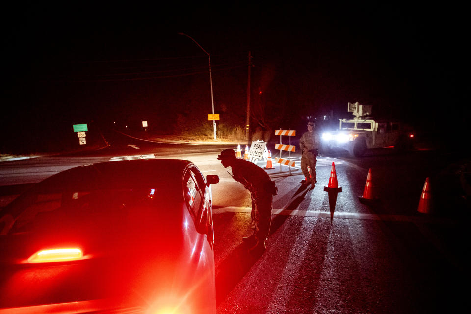 California National Guard Sgt. Carranza mans a checkpoint in unincorporated Sonoma County, Calif., near Healdsburg on Sunday, Oct 27, 2019. To prevent its power lines from sparking in the high winds and setting off more blazes, Pacific Gas & Electric shut off power to 2.3 million people across 30 some counties this weekend. (Photo: Noah Berger/AP)