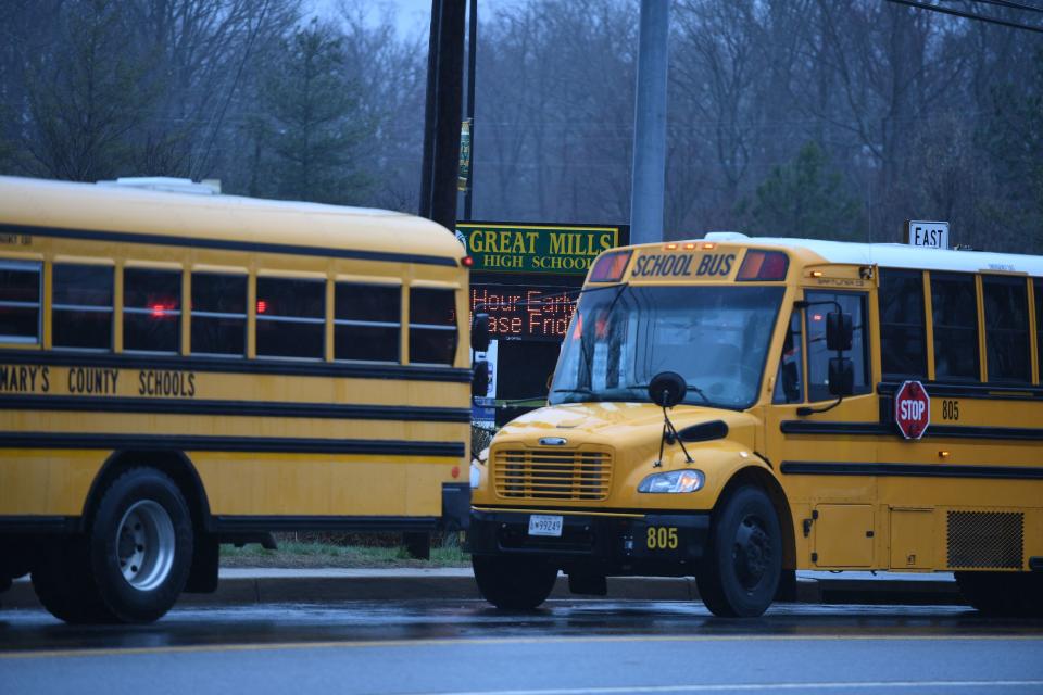 School buses are seen near the school.&nbsp;