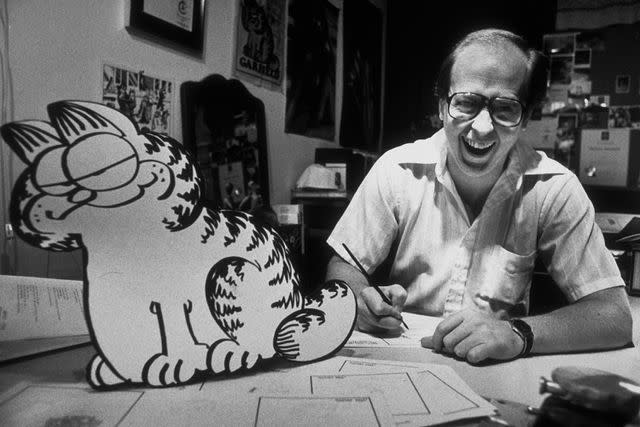 <p>Thomas S. England/Getty</p> Jim Davis and Garfield