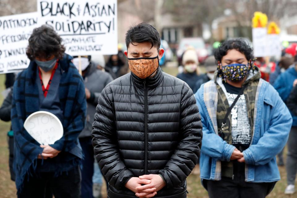 People stand in solidarity during a vigil and rally against Asian hate crimes, Friday, March 26, 2021, at Chicago's Horner Park. The event is organized by local Chicago organizations led by Asian Americans and Pacific Islanders. (AP Photo/Shafkat Anowar) ORG XMIT: ILSA106