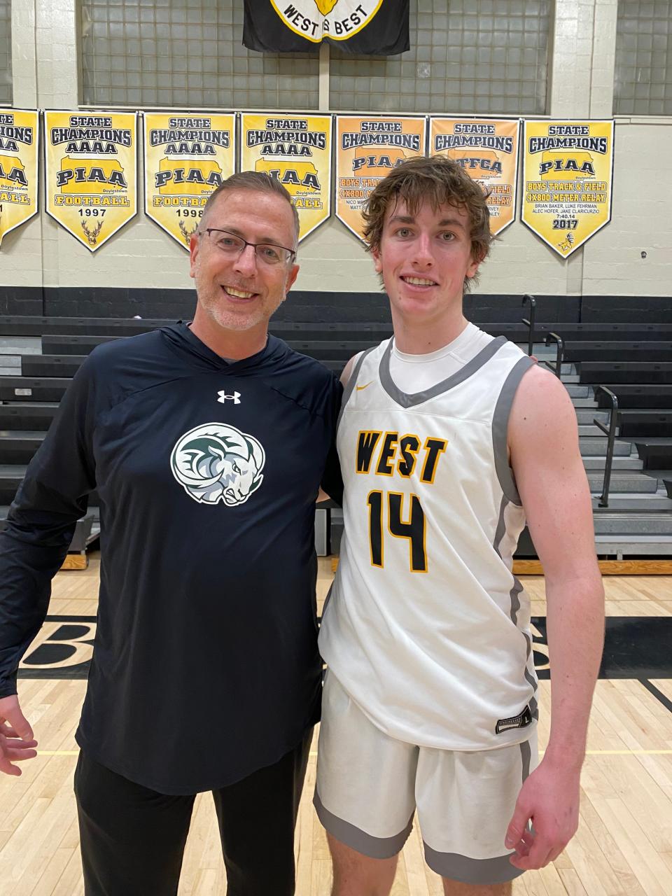 Stephen Cashman, the Pennridge principal, and son Charlie, a Central Bucks West senior, pose after a January 24 game against Central Bucks East.