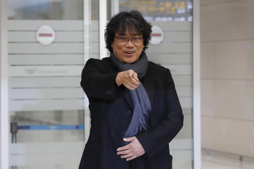 South Korean director Bong Joon-ho gestures upon his arrival at the Incheon International Airport in Incheon, South Korea, Sunday, Feb. 16, 2020. South Koreans are reveling in writer-director Bong's dark comic thriller, "Parasite," which won this year's Academy Awards for best film and best international feature. The movie itself, however, doesn't put the country in a particularly positive light. (AP Photo/Ahn Young-joon)