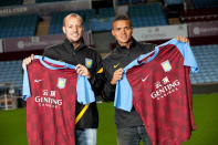 BIRMINGHAM, UNITED KINGDOM - AUGUST 31: Alan Hutton and Jermaine Jenas pose after signing for Aston Villa at Villa Park on August 31, 2011 in Birmingham, England. (Photo by Neville Williams/Aston Villa FC via Getty Images)