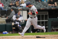 Washington Nationals' Keibert Ruiz scores on a sacrifice fly by Victor Robles during the eighth inning in the first baseball game of the team's doubleheader against the Chicago White Sox, Tuesday, May 14, 2024, in Chicago. (AP Photo/Erin Hooley)