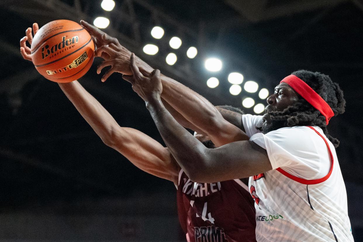 The Ville's Montrezl Harrell (5) fights for the rebound against UKnighted's Ginikachukwu Ojiako (44) during their game on Saturday, July 20, 2024 in Louisville, Ky. at Freedom Hall during the first round of The Basketball Tournament.