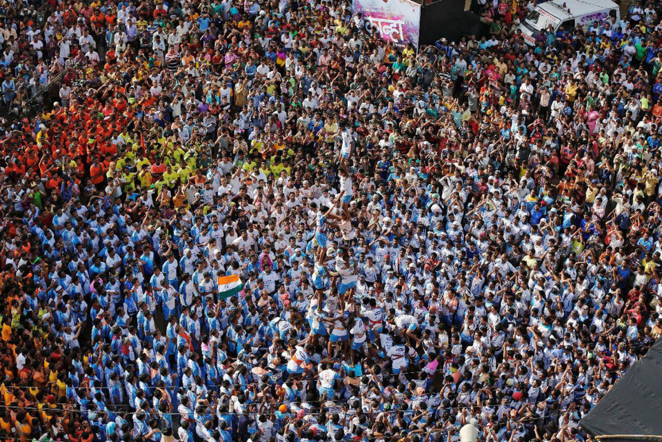 <p>Devotees form a human pyramid to celebrate the festival of Janmashtami, marking the birth anniversary of Hindu Lord Krishna, in Mumbai, India Aug. 25, 2016. (Photo: Shailesh Andrade/Reuters) </p>