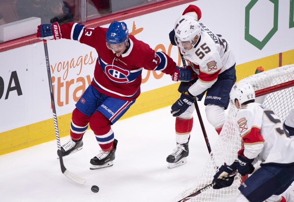 Montreal Canadiens' Max Domi tries to handle the puck away from Florida Panthers' Bogdan Kiselevich during the first period of an NHL hockey preseason game Wednesday, Sept. 19, 2018, in Montreal. (Paul Chiasson/The Canadian Press via AP)