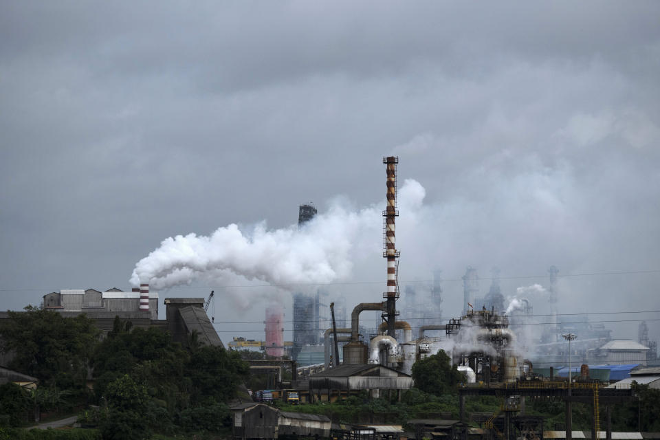 FILE - Steam emits from a crude oil refinery in Kochi, Kerala state, India, on Aug. 26, 2022. A new accounting of carbon dioxide emissions finds that heat-trapping gas pollution from fossil fuels went up about 1% more than last year. Researchers say efforts to remove carbon dioxide from the atmosphere aren't being scaled up fast enough and can’t be relied on to meet crucial climate goals. A report published Thursday by scientists in Europe and the United States found that new methods of CO2 removal currently account for only 0.1% of the 2 billion metric tons sucked from the atmosphere each year. (AP Photo/R S Iyer, File)