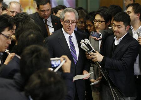U.S. Trade Representative Michael Froman (C) speaks to media after meetings with Japan's Economics Minister Akira Amari (not in picture) in Tokyo April 10, 2014. REUTERS/Issei Kato