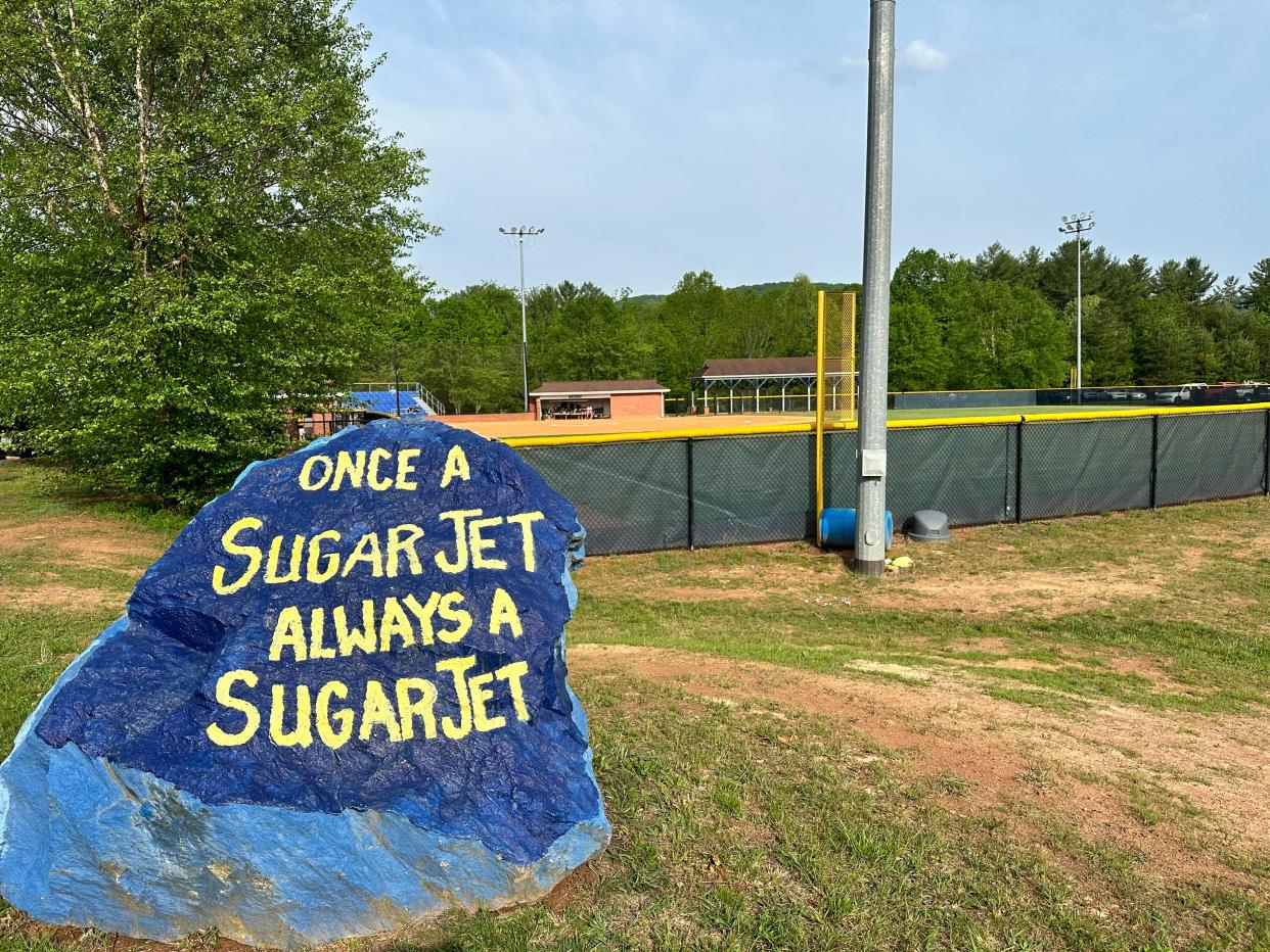A rock outside the Enka softball field reads, "Once a Sugar Jet, Always a Sugar Jet."